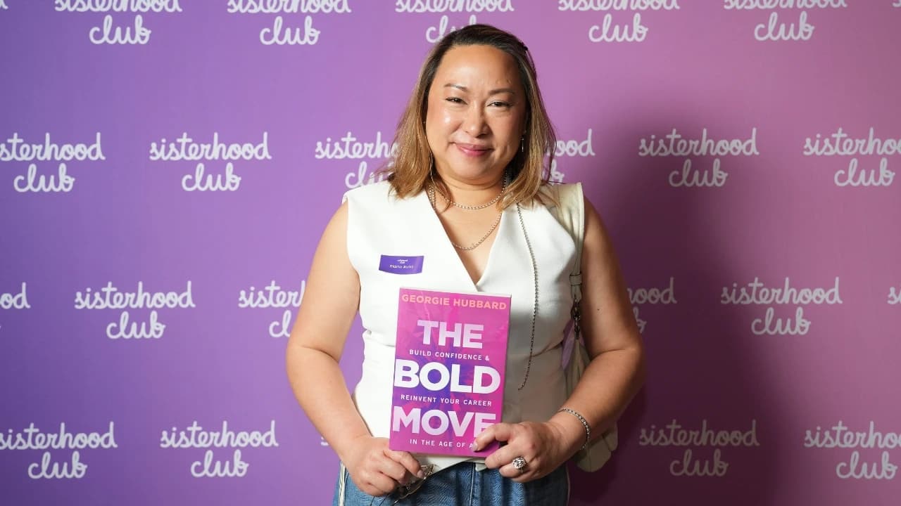 Attendees holding The Bold Move book